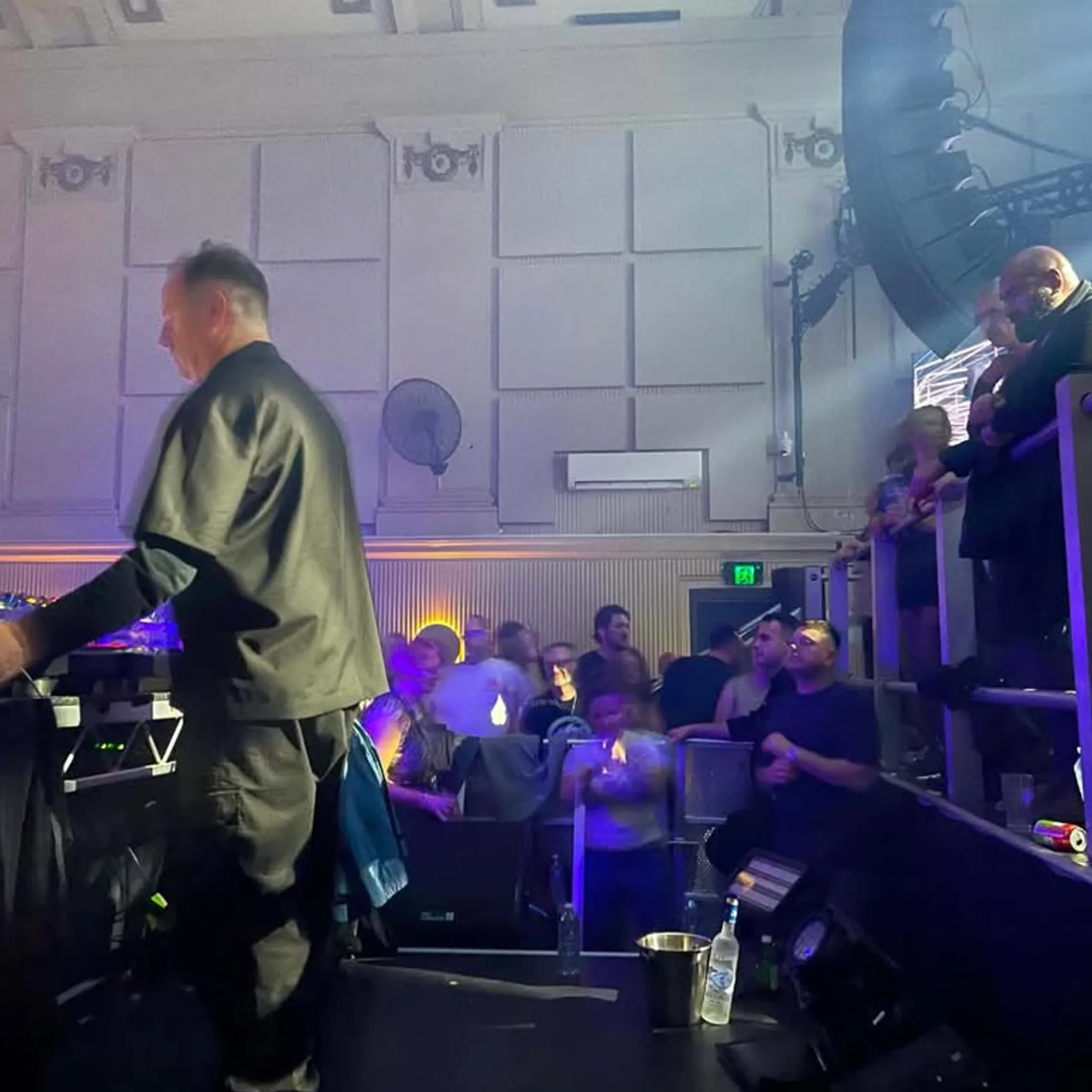 dj performing to lively crowd