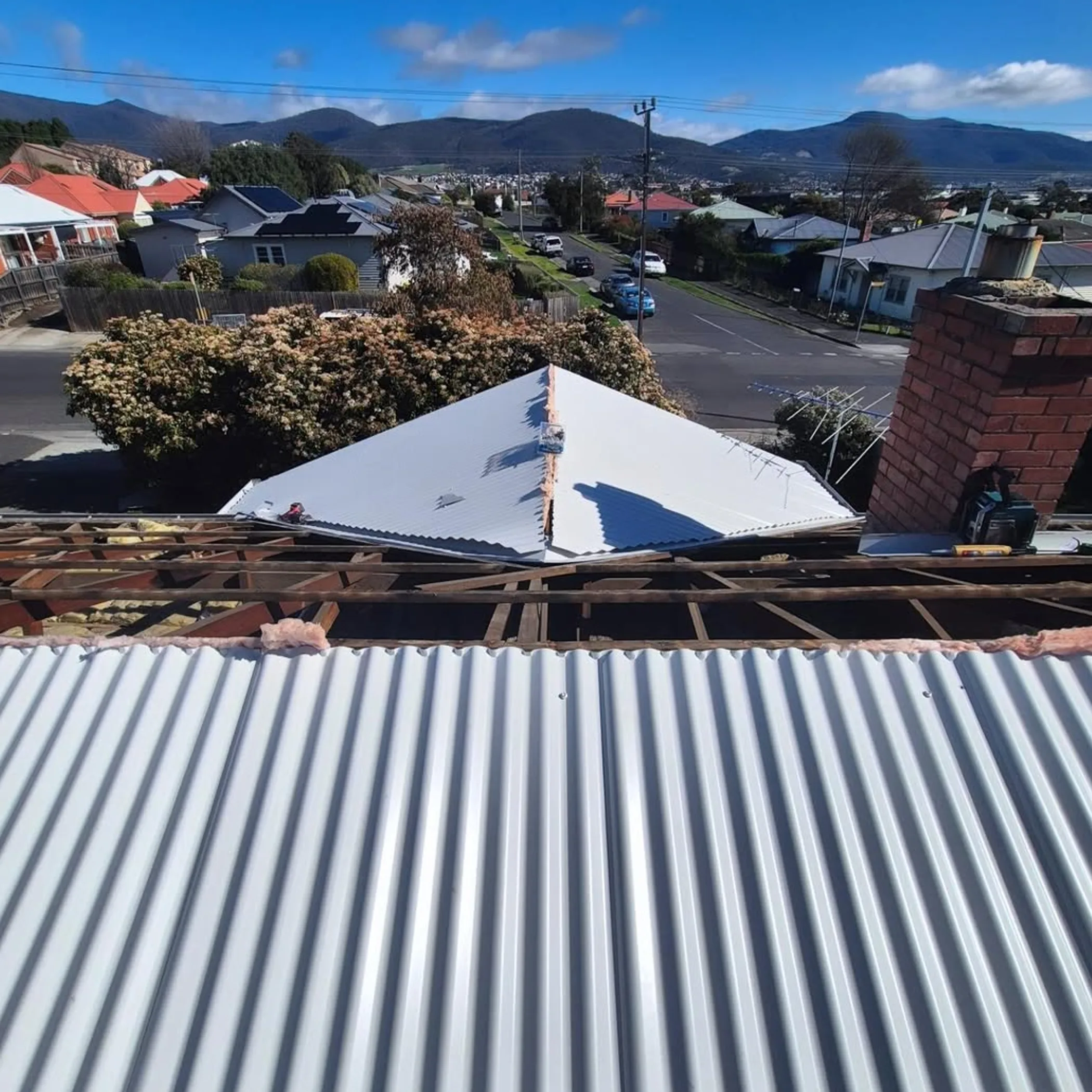 active roof repair with exposed rafters