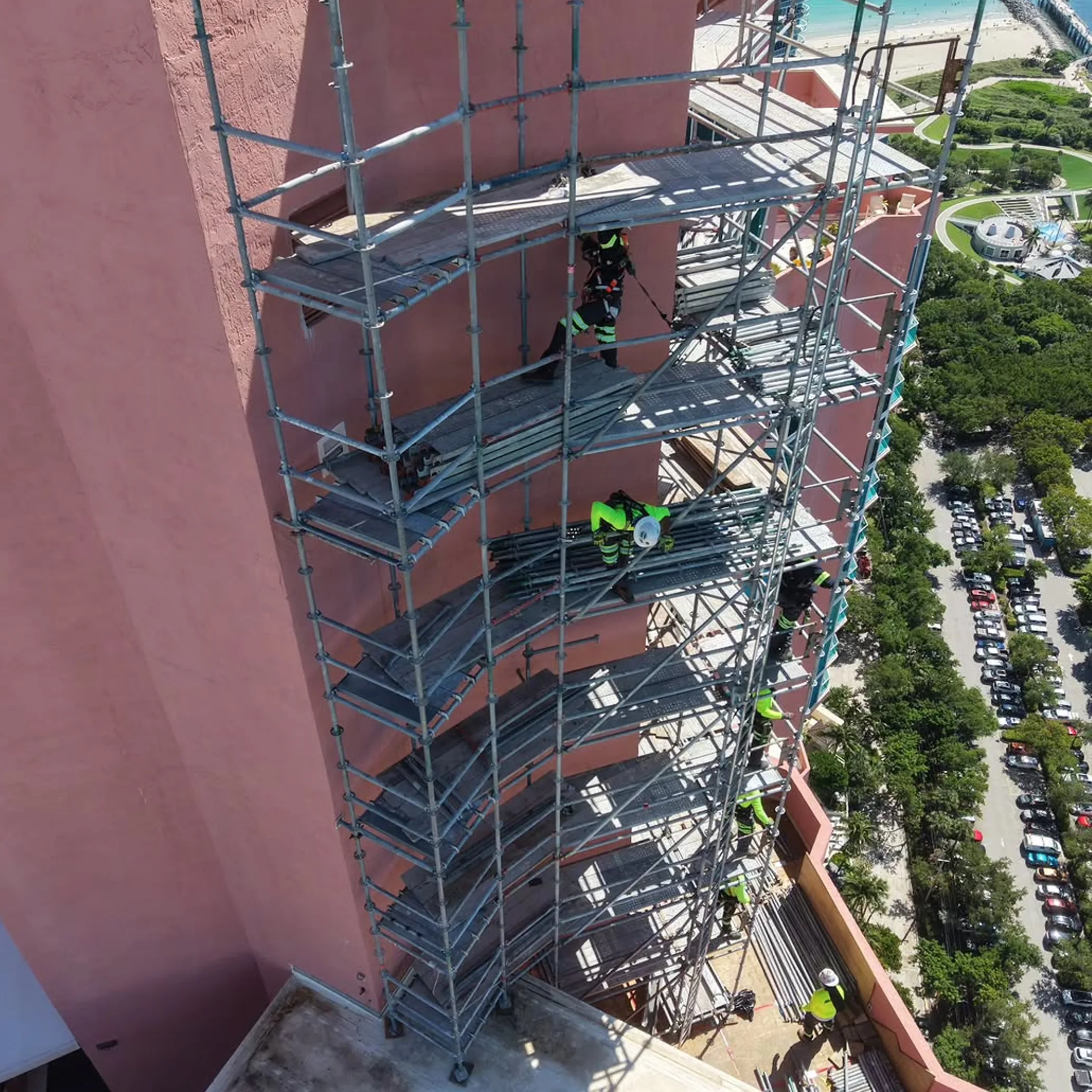 workers performing high-rise facade maintenance